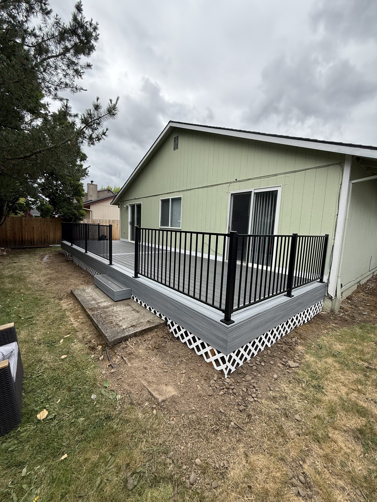 Gray composite deck on ranch